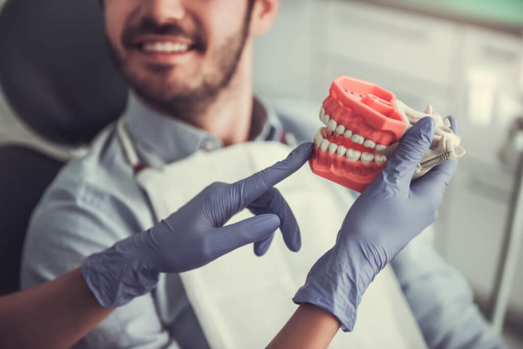 My Dentist at Morgan Creek - Man Looking at Denture