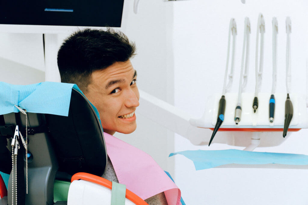 My Dentist at Morgan Creek - Young Man Smiling in Dentist Chair