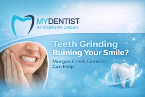 woman sitting holding her face in discomfort, illustrating jaw pain from teeth grinding, with a banner overlay displaying the My Dentist at Morgan Creek logo and the text “Teeth Grinding Ruining Your Smile? Morgan Creek Dentists Can Help.